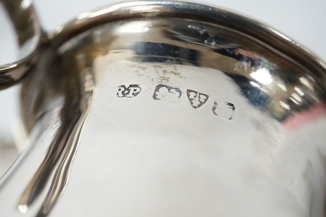 An Edwardian small silver baluster mug, Robert Pringle & Sons, Chester, 1906, 78mm, together with small silver trophy cup, a sterling pin tray and a silver condiment spoon. Condition - fair